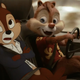 A CG Dale the chipmunk smiles at a groaning Chip the chipmunk as they drive a real toy car.
